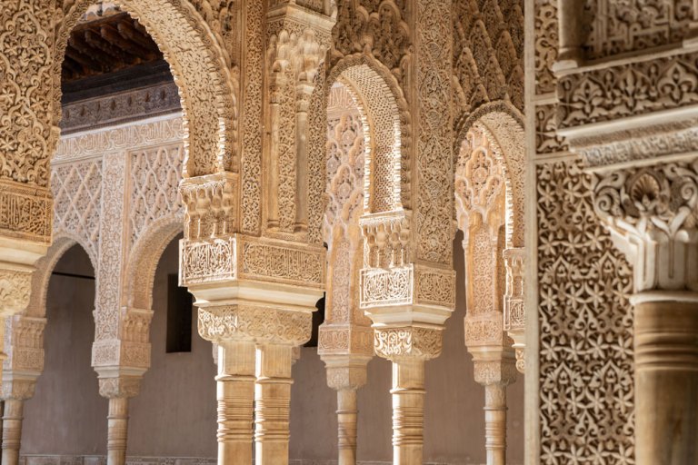 Intricate Moorish arches with detailed carvings and columns.